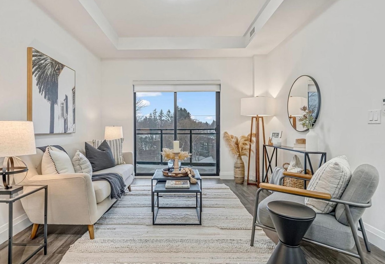 Staged living room with balcony view